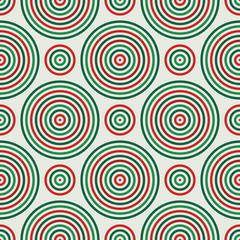 Seamless pattern in Christmas traditional colors with round vortexes. Repeated circles ornamental wallpaper.