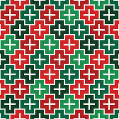 Repeated puzzle mosaic abstract background. Seamless pattern in Christmas traditional colors with simple ornament.