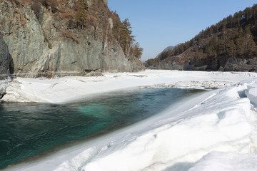 Floating of ice on the turquoise river in the spring, Katun River, Altai, Russia
