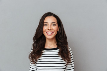 Fototapeta premium Portrait of a smiling girl standing