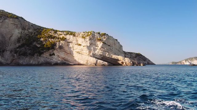 view from the water on a beautiful island in Greece.