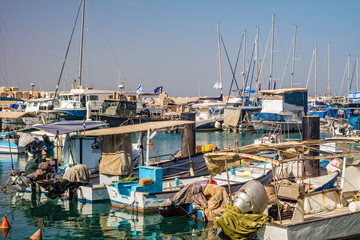 Fishing boats at old Jaffo port in Tel Aviv, Israel. - obrazy, fototapety, plakaty