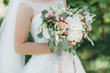 Bride with bouquet on the wedding.