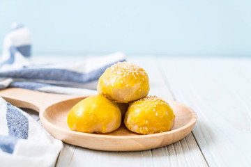 Chinese pastry or moon cake filled with mung bean paste and salted egg yolk