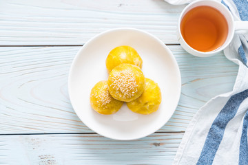 Chinese pastry or moon cake filled with mung bean paste and salted egg yolk