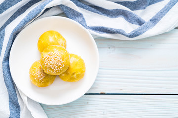 Chinese pastry or moon cake filled with mung bean paste and salted egg yolk