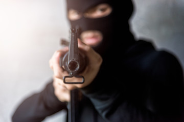 Naklejka premium Gunman killer was aiming his gun focus at gun tip