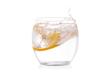 Glass of water with lemon isolated