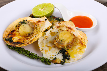 Baked scallops with spinach