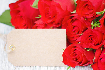 red rose flowers bouquet and a card for text