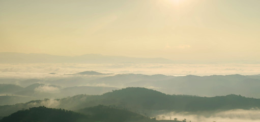 Landscape of mountain with the clouds and fog, Top view of the haze on the mountain, The foggy morning at the mountain.