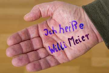 Hand with wrote down names