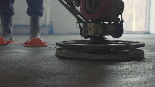 Mechanized grout screed concrete floor close-up slow motion