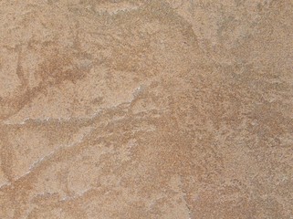 The brown tile. Background beige floor tiles. Beautiful ceramic tile is sand color. Brown tiles for kitchen and bathroom.