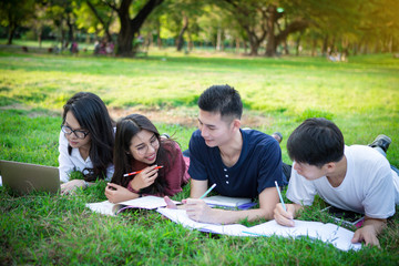 group of high school student learning in a park together