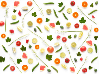 Pattern of of flowers and fruits. Abstract food background, top view, flat lay. Composition of  lily of the valley, currant leaves, tangerines, tomatoes, grapefruit, isolated on white background.