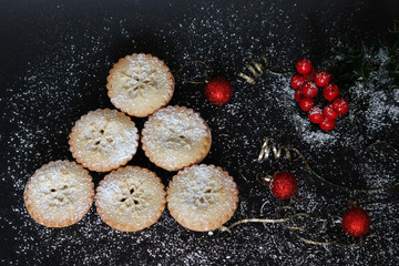 Mince pies on black background 