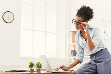 Business woman working on laptop at office