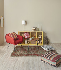 decorative wooden bookshelf and red chair concept pillow style