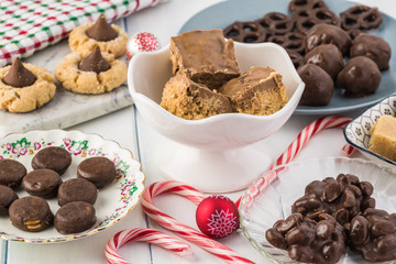 Homemade chocolate candies and cookies for Christmas party table.
