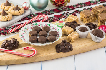 Homemade chocolate candies and cookies for Christmas party table.