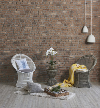 modern brick wall home design wicker chair yellow blanket interior design