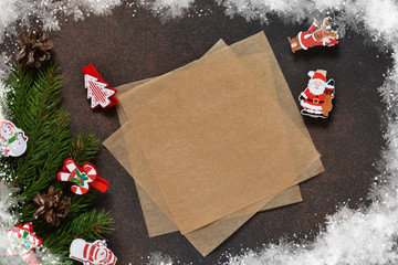 New Year card. Letter for Santa. Christmas tree and decorative clothespins on a brown background with space under the text.