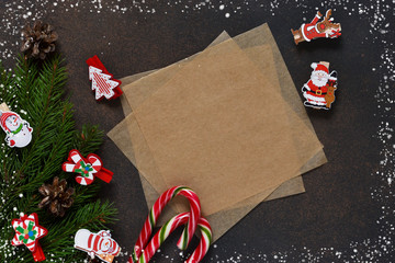 New Year card. Letter for Santa. Christmas tree and decorative clothespins on a brown background with space under the text.