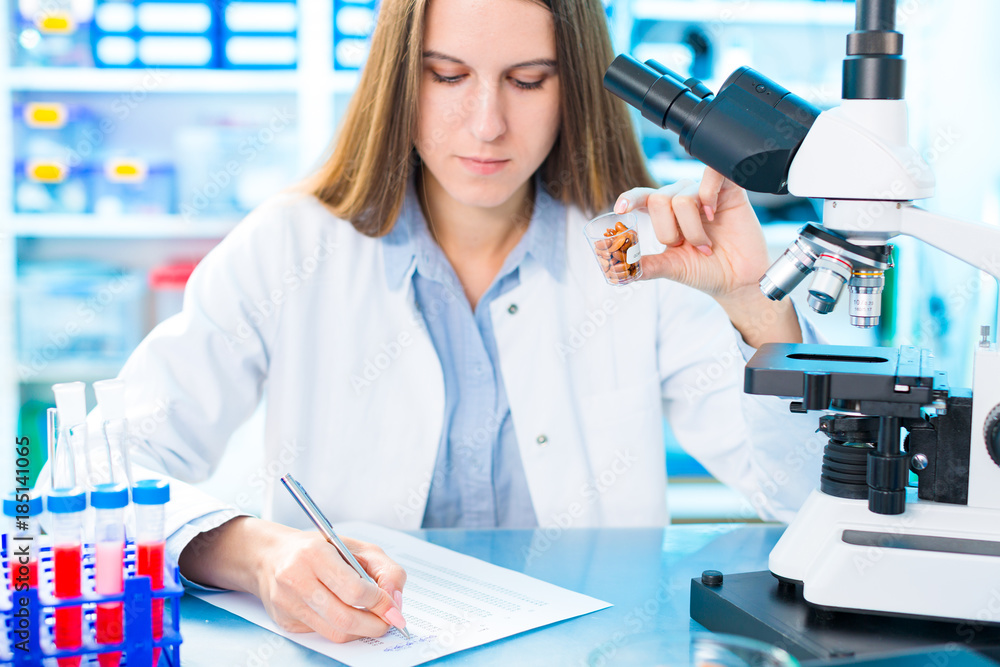 Wall mural Selective and genetic work with seeds and grains in a scientific laboratory. Food quality control