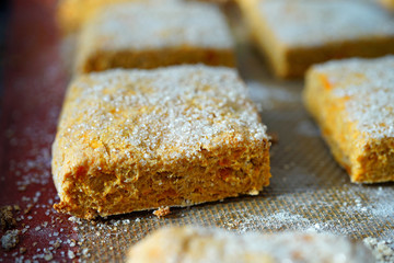 Baking square sweet potato scones with sugar on top 