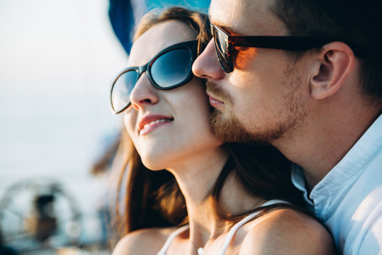 A very sensual photo of a beautiful couple in love who meets a beautiful sunset together