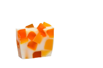 Orange mosaic handmade soap on a white background.