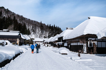 Fototapeta na wymiar Thatched roof house Ouchi Juku village, Fukushima, Tohoku, Japan in Winter snow