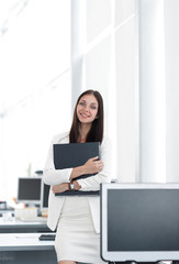 female assistant with documents standing in the office.photo with copy space.