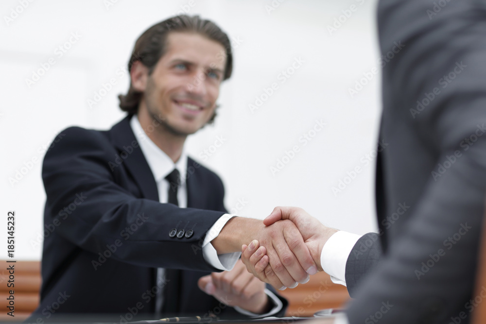 Wall mural handshake manager and the client sitting in the office