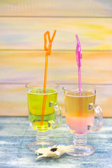 Tropical cocktails with bright straws