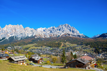 Fototapeta na wymiar Panoramic view of Cortina d'Ampezzo in autumn time. It is the most charming ski resort in Italy. Cortina is also known as the Pearl of the Dolomites, Italy.