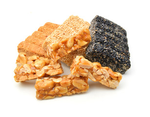 Honey bars with peanuts, sesame and sunflower seeds isolated