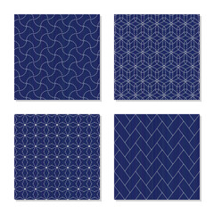 Japanese sashiko ornaments. Set. Asian embroidery motifs. Abstract Seamless patterns. Four simple textures. White stitches on the indigo blue background. For handicraft or decoration.