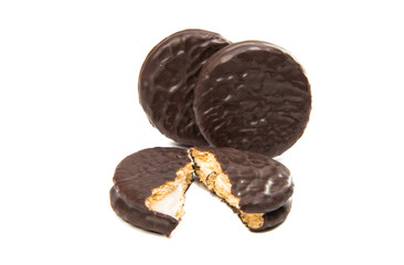 Bitten biscuit sandwich with chocolate.