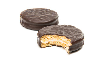 Bitten biscuit sandwich with chocolate.