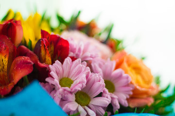 Bunch of various fresh flowers with water drops