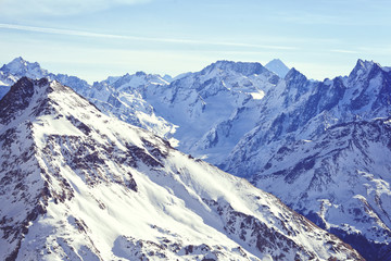Snow tops of the mountains of the Great Caucasus Range. Ski resort of Elbrus.