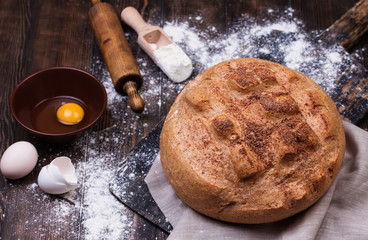 Bread on wooden table, top view.