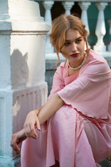 Young cute stylish princess girl in pink fashionable dress and in valuable jewellery - 185153450