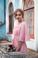 Young cute stylish princess girl in pink fashionable dress and in valuable jewellery - 185153470