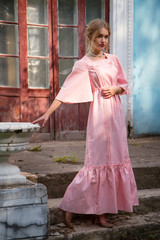 Young cute stylish princess girl in pink fashionable dress and in valuable jewellery - 185153490