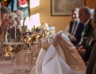 Glass of white vine on family celebration