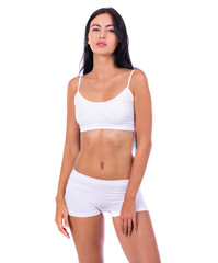 Fototapeta premium Sexy woman in white fitness clothing