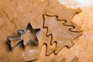 Preparing Christmas gingerbread cookies. Gingerbread dough and  cookies ingredients. Christmas tree shape.